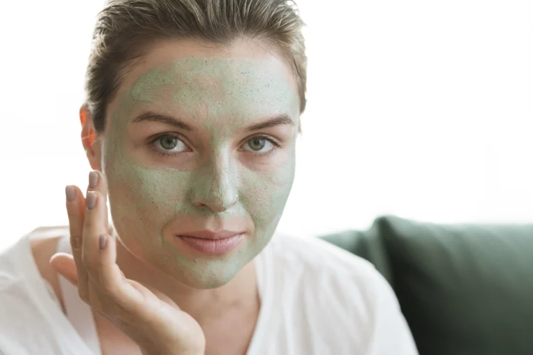 Woman applying aloe vera face mask for soothing and hydration
